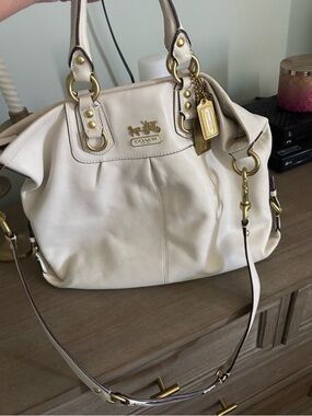 pastel pink and gold coach bag